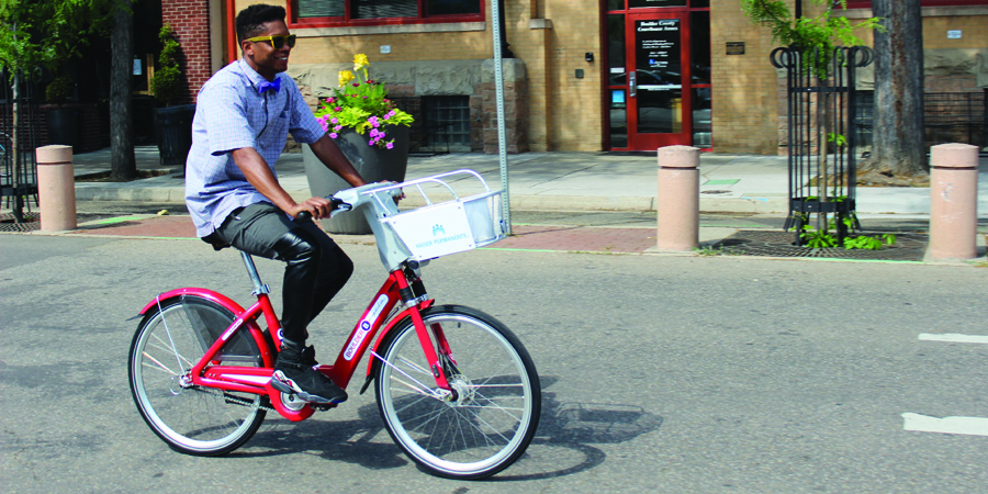 Spandex A stylish man rides a B-cycle