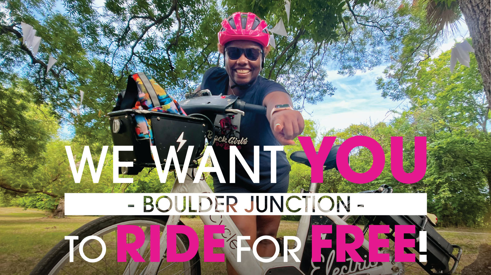 A Boulder B-cycle rider next to a B-station