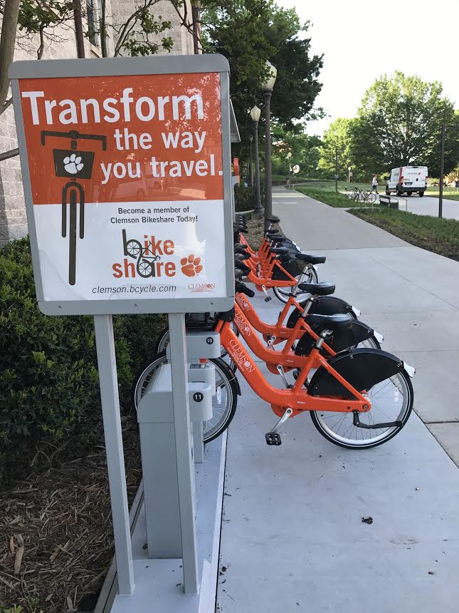Clemson Bike Share Station with Sign reading, Transform the Way You Travel